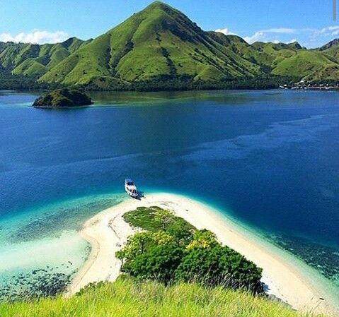 Kelor Island with white sandy beach and crystal clear water